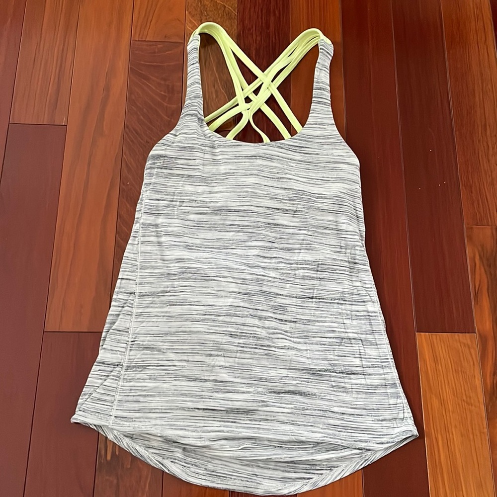 Lululemon tank with lime green built in bra. Size 2. Great condition.